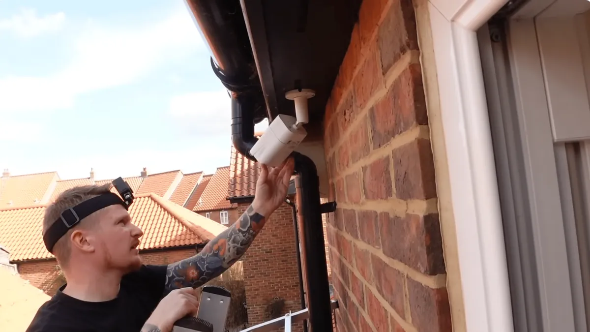 Indoor security camera monitoring a living room