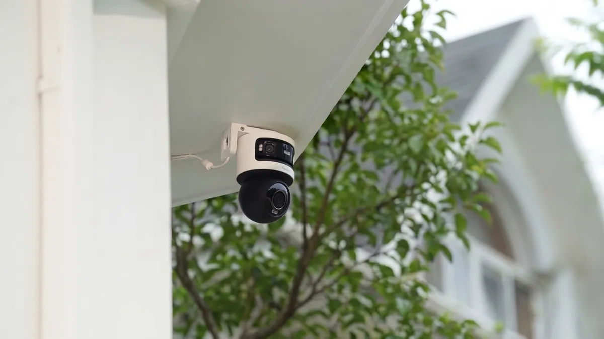 Technician installing a security camera system